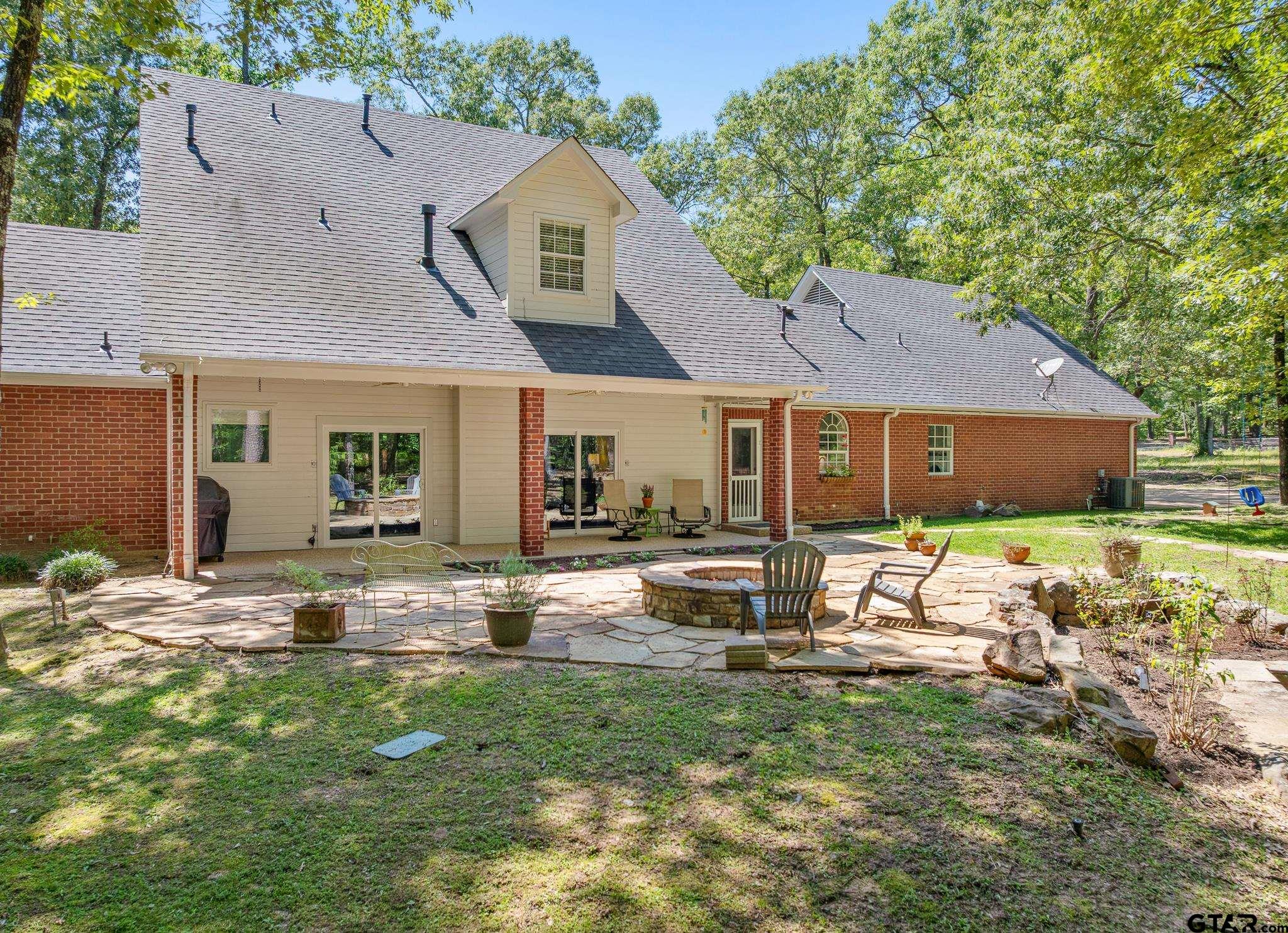 18076 Deer Trail Flint, TX 75762 - Photo 36 of 46 a view of a house with backyard and sitting area