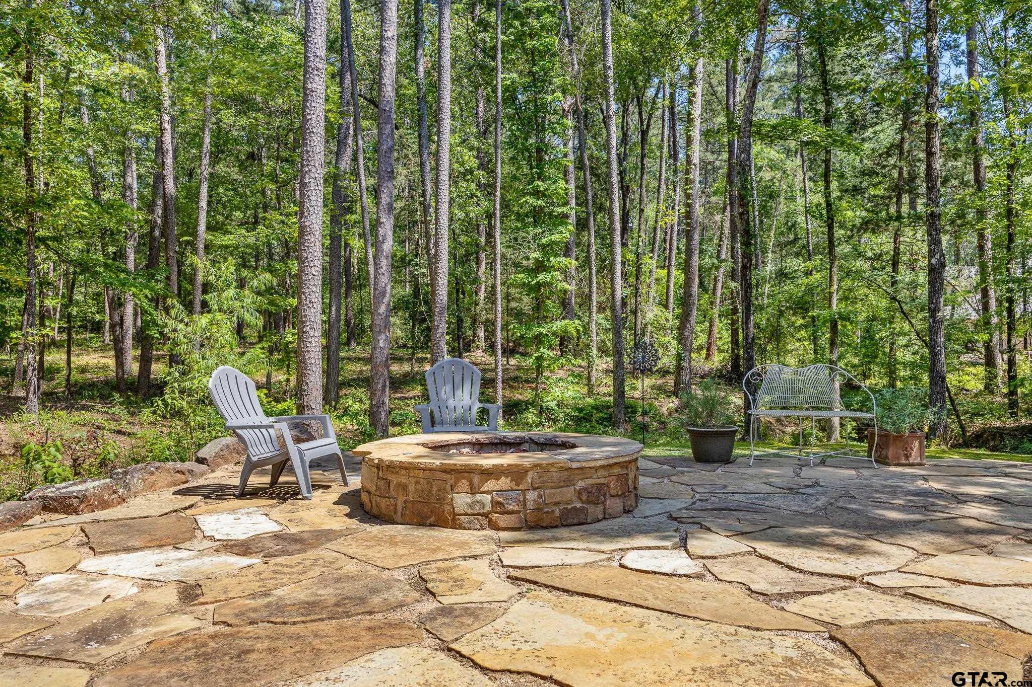 18076 Deer Trail Flint, TX 75762 - Photo 37 of 46 a view of a patio with table and chairs and potted plants