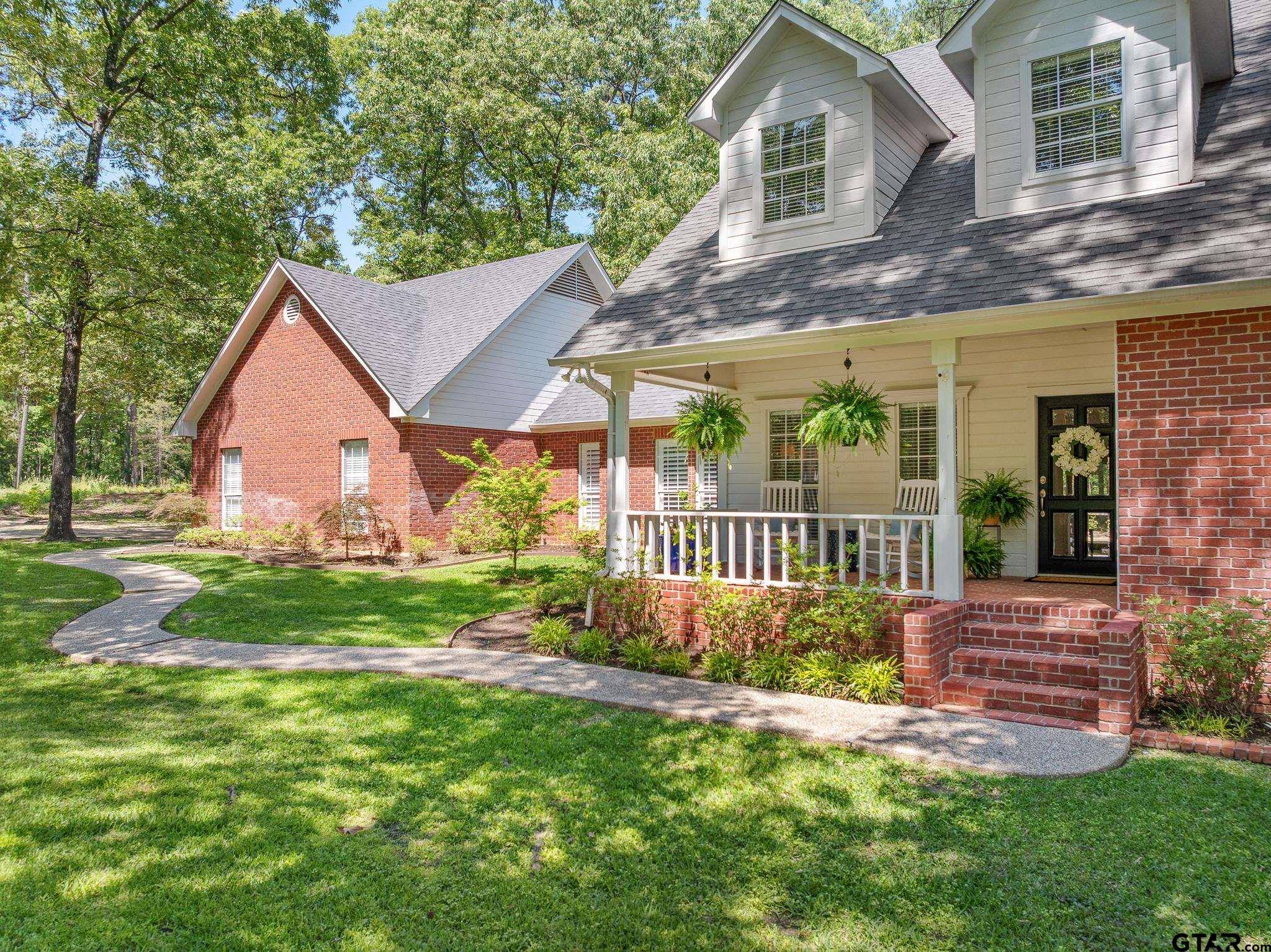18076 Deer Trail Flint, TX 75762 - Photo 4 of 46 a view of a house with backyard and garden