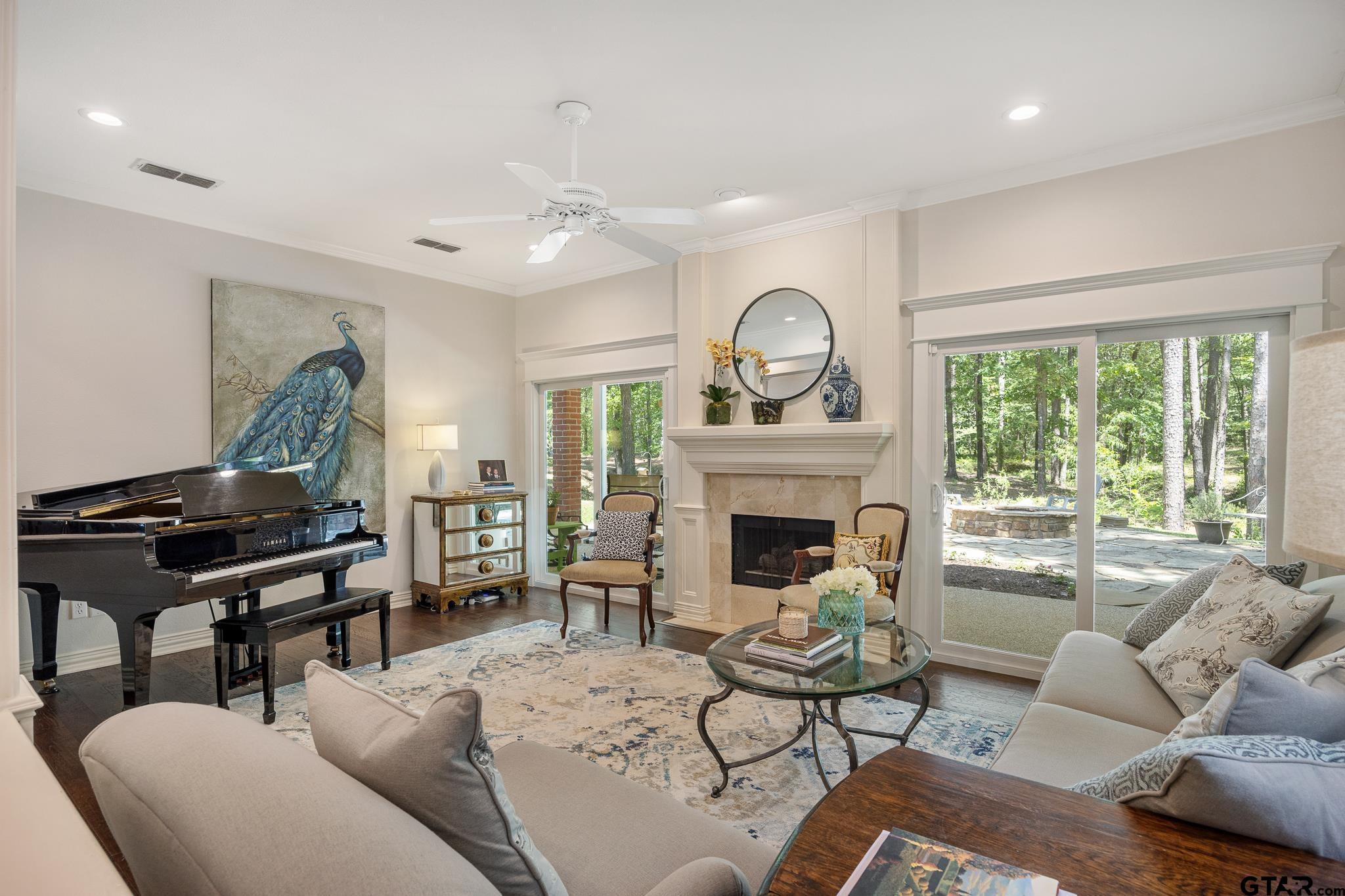 18076 Deer Trail Flint, TX 75762 - Photo 9 of 46 a living room with furniture a fireplace and a large window