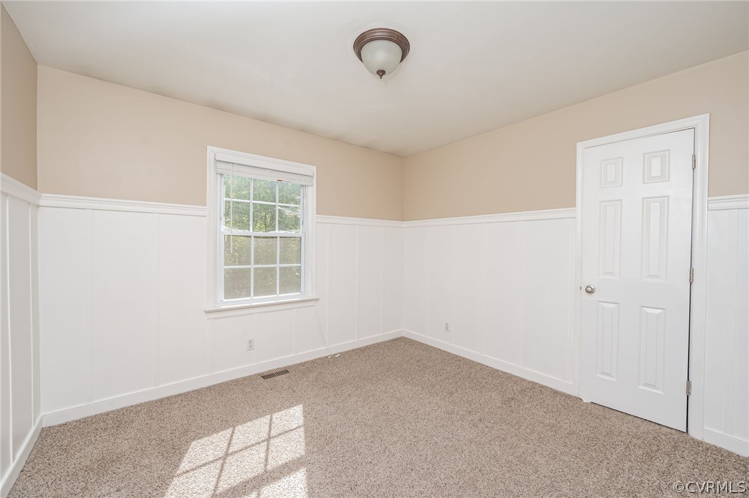 5427 Standing Oak Road Midlothian, VA 23112 - Photo 24 of 33 an empty room with windows