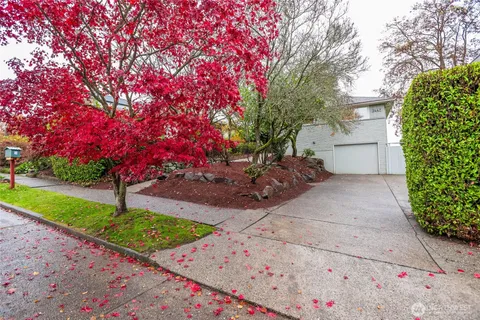 a pathway of a house with a yard