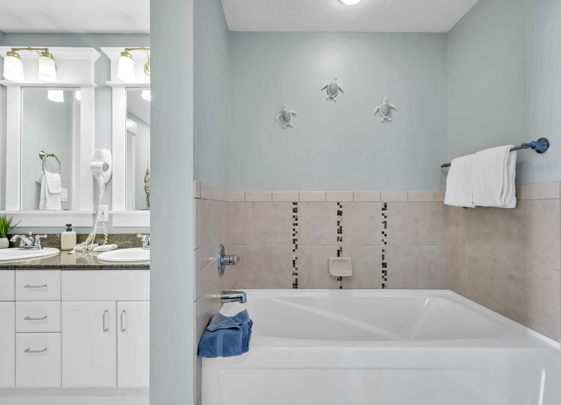 11800 Front Beach Road, Unit 2408 Panama City Beach, FL 32407 - Photo 14 of 42 a bathroom with a bathtub and a sink
