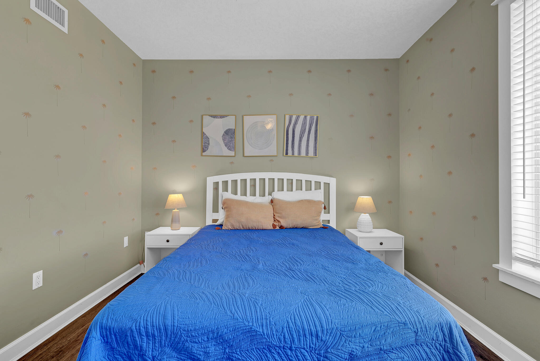 11800 Front Beach Road, Unit 2408 Panama City Beach, FL 32407 - Photo 20 of 42 a large bed sitting in a bedroom next to a window