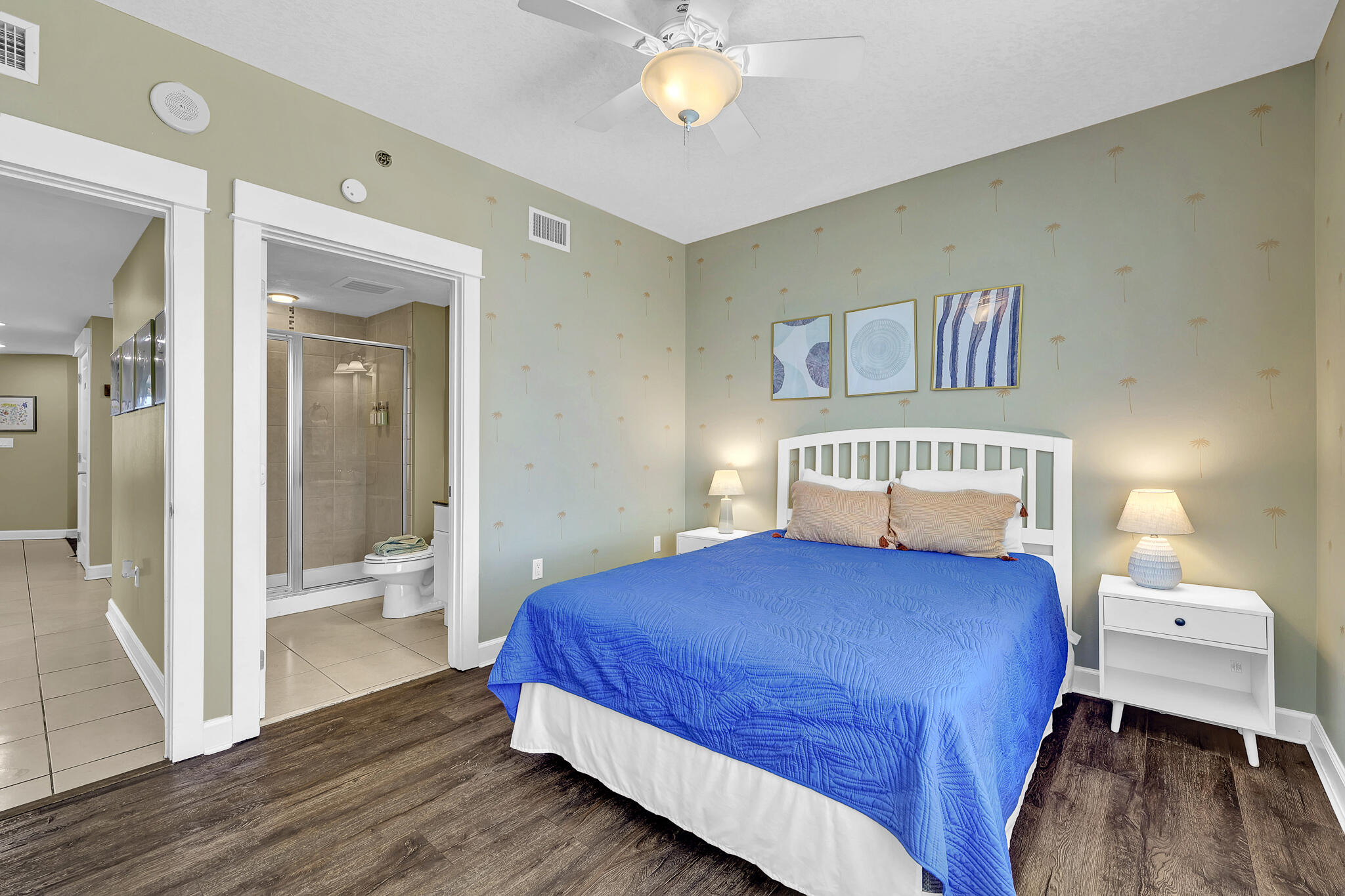 11800 Front Beach Road, Unit 2408 Panama City Beach, FL 32407 - Photo 22 of 42 a bedroom with a bed and a chandelier