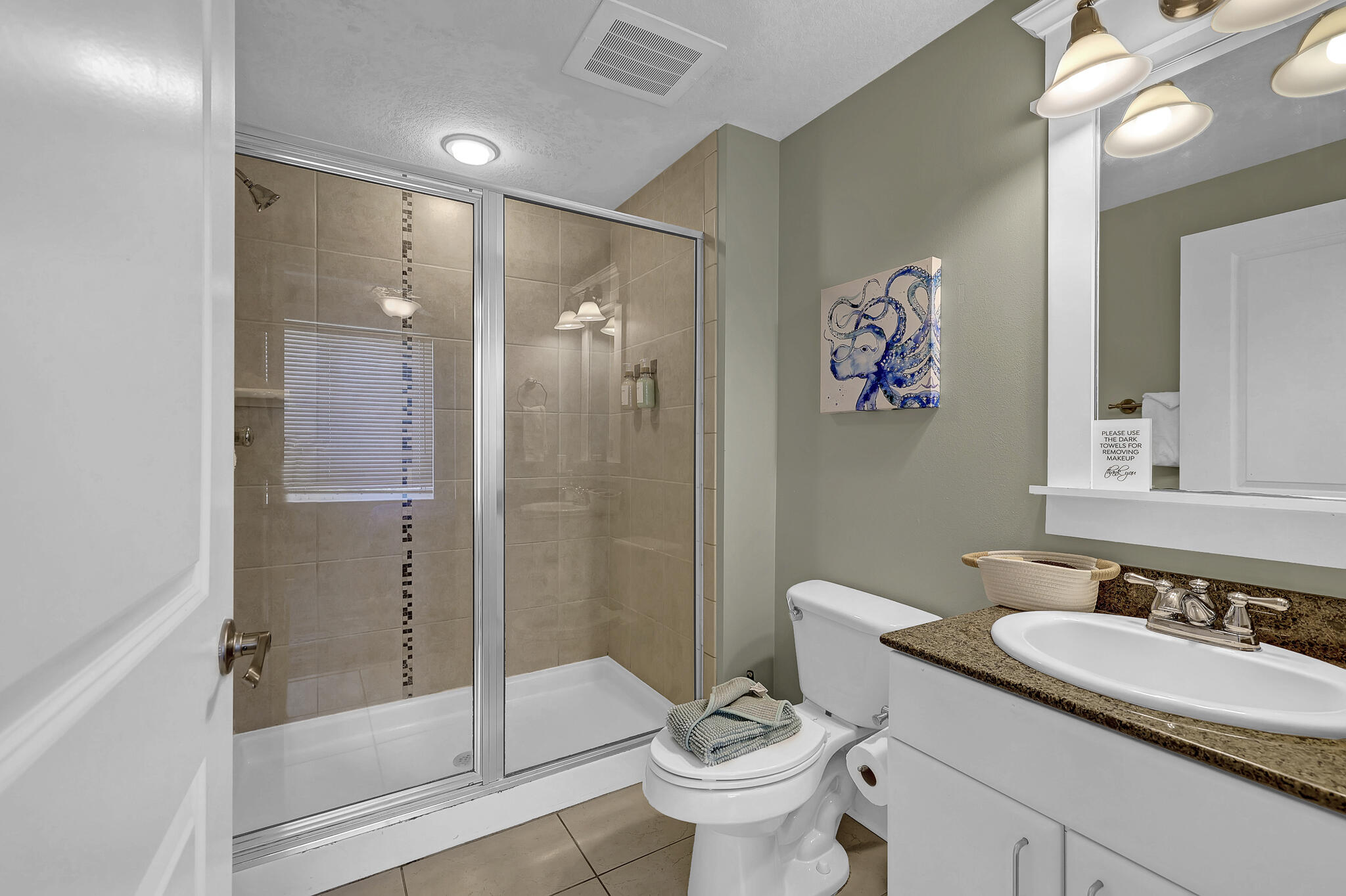 11800 Front Beach Road, Unit 2408 Panama City Beach, FL 32407 - Photo 23 of 42 a bathroom with a sink toilet and shower