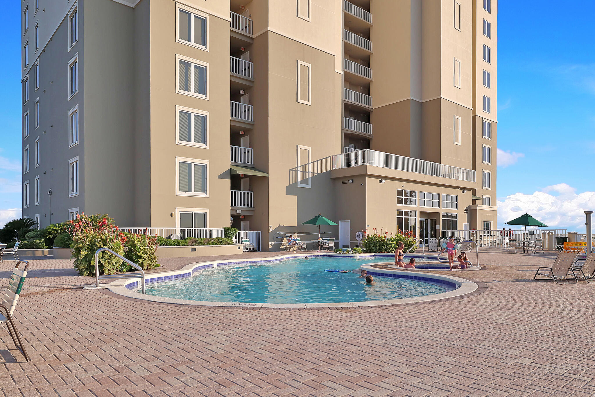 11800 Front Beach Road, Unit 2408 Panama City Beach, FL 32407 - Photo 30 of 42 a view of a building with cars parked