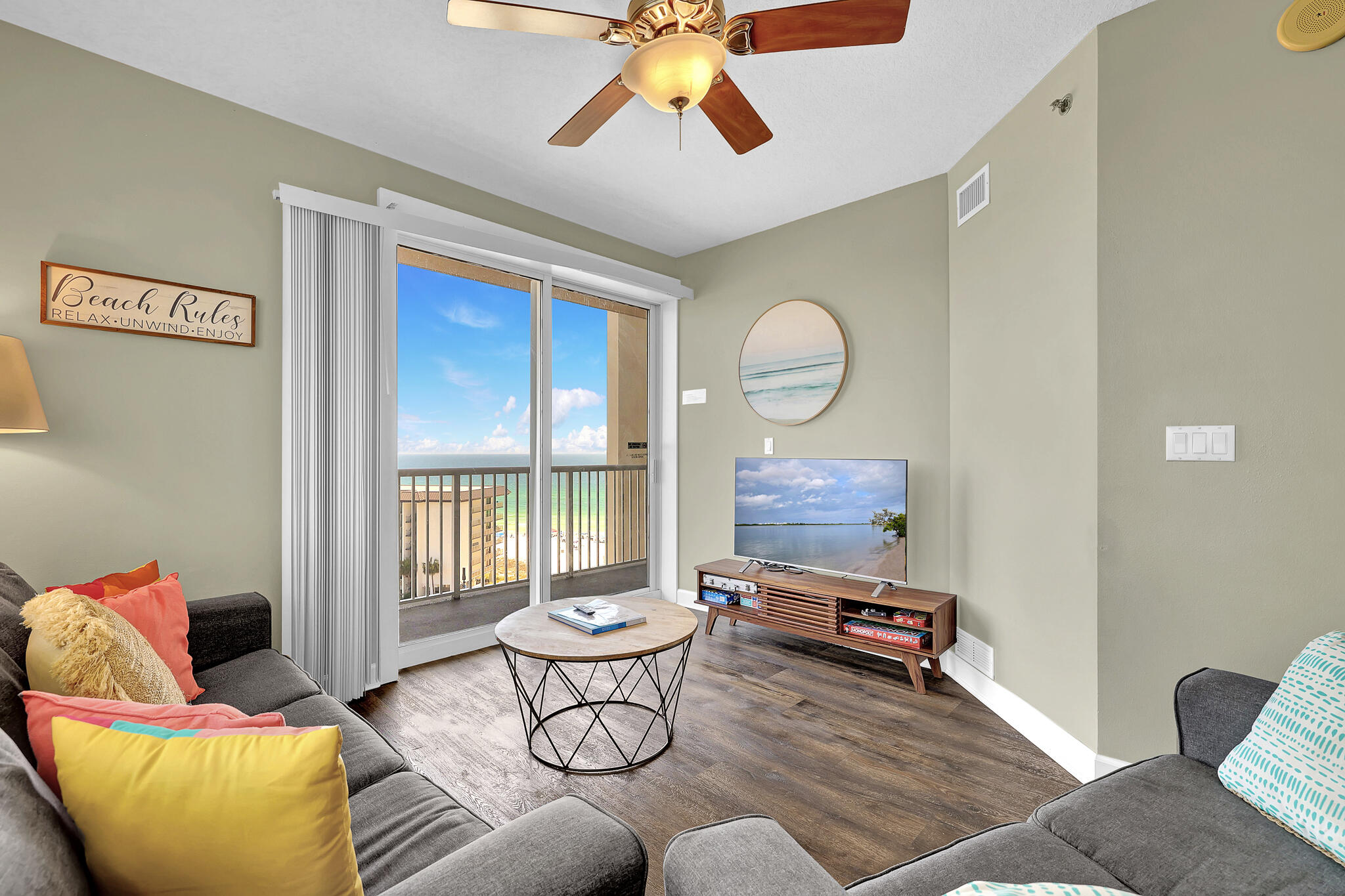 11800 Front Beach Road, Unit 2408 Panama City Beach, FL 32407 - Photo 3 of 42 a living room with furniture and a large window