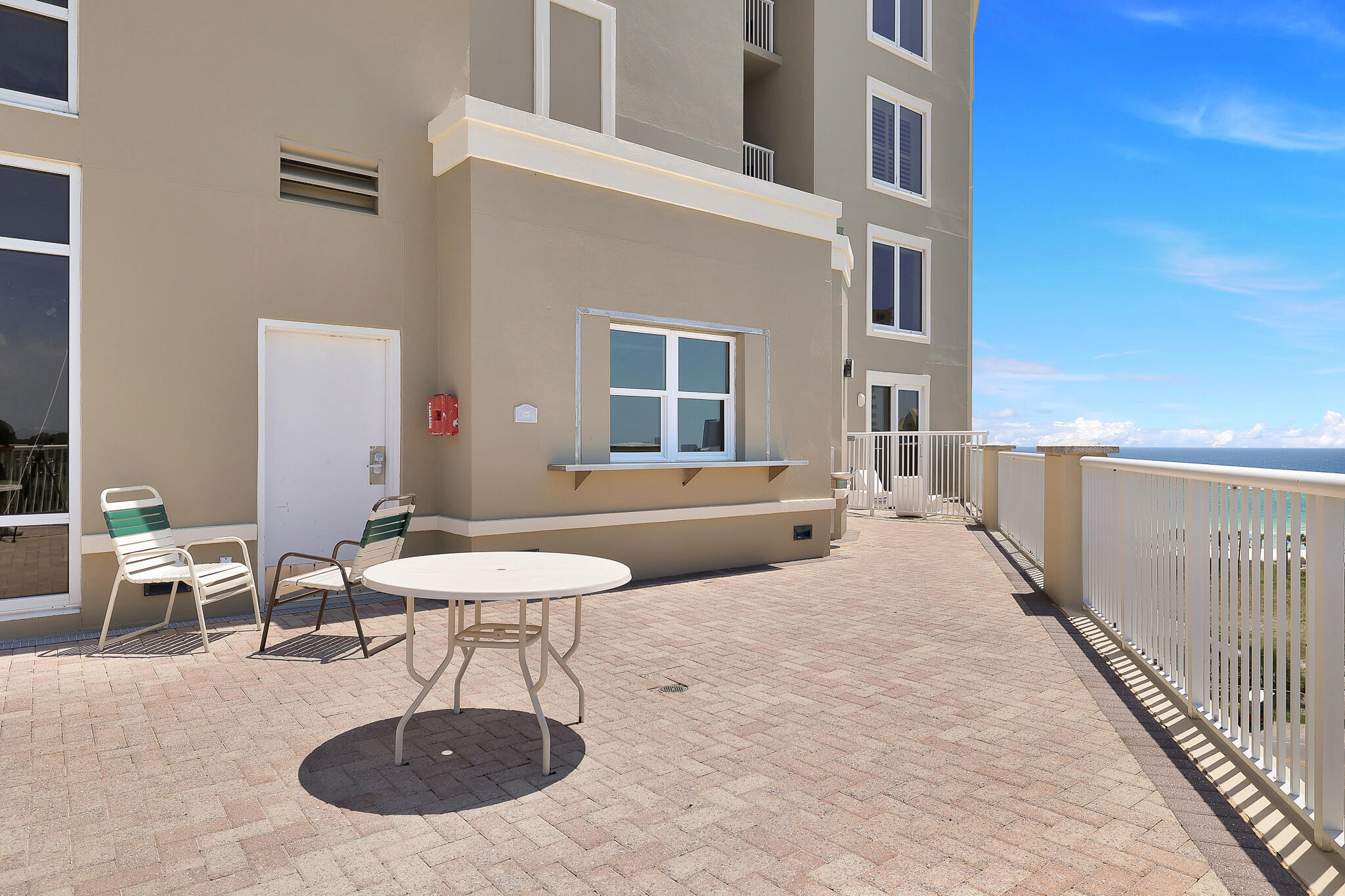 11800 Front Beach Road, Unit 2408 Panama City Beach, FL 32407 - Photo 39 of 42 a building outdoor space with patio furniture