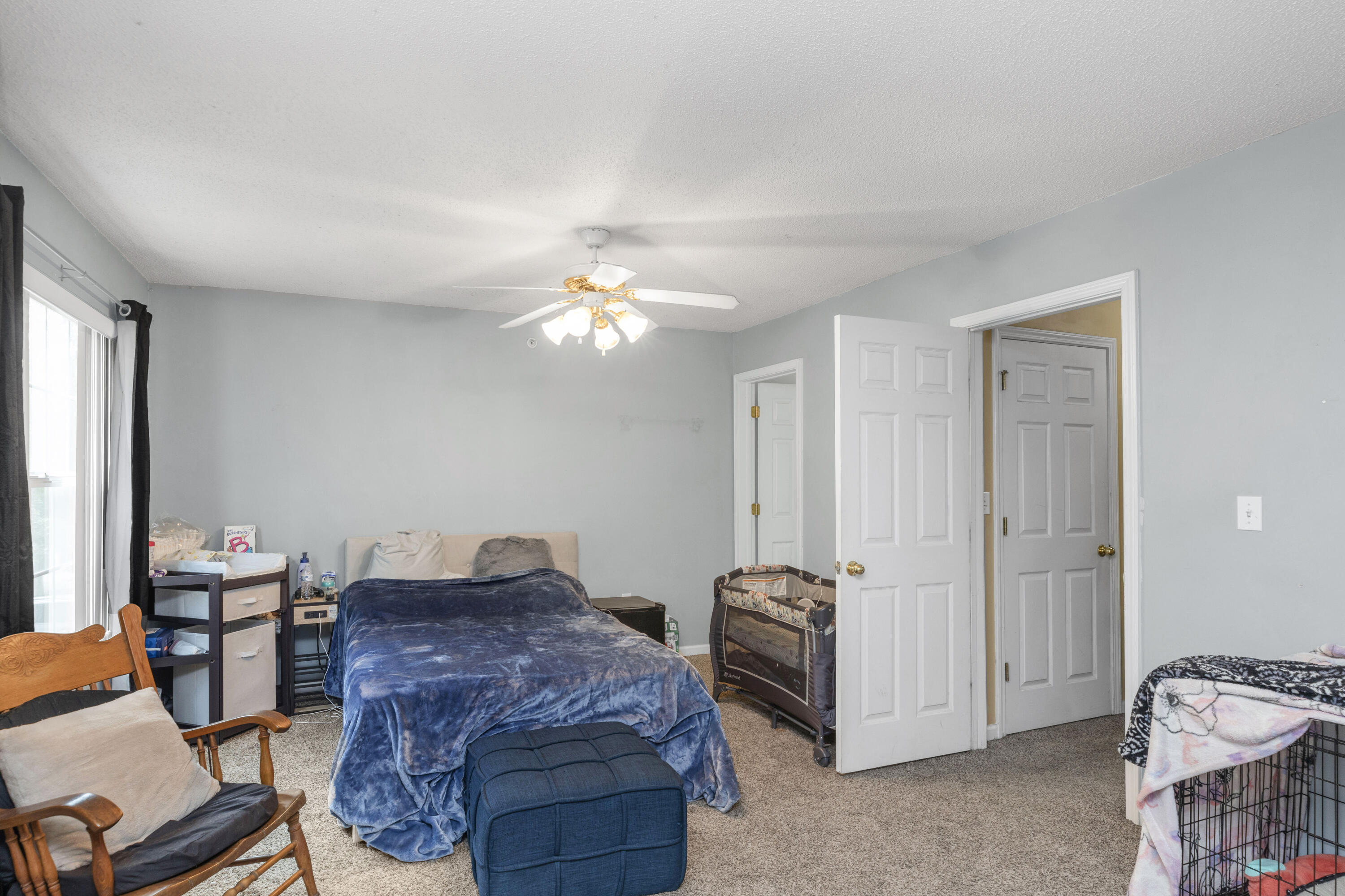 341 Crooked Pine Trail Crestview, FL 32539 - Photo 13 of 27 a living room with furniture and a chandelier