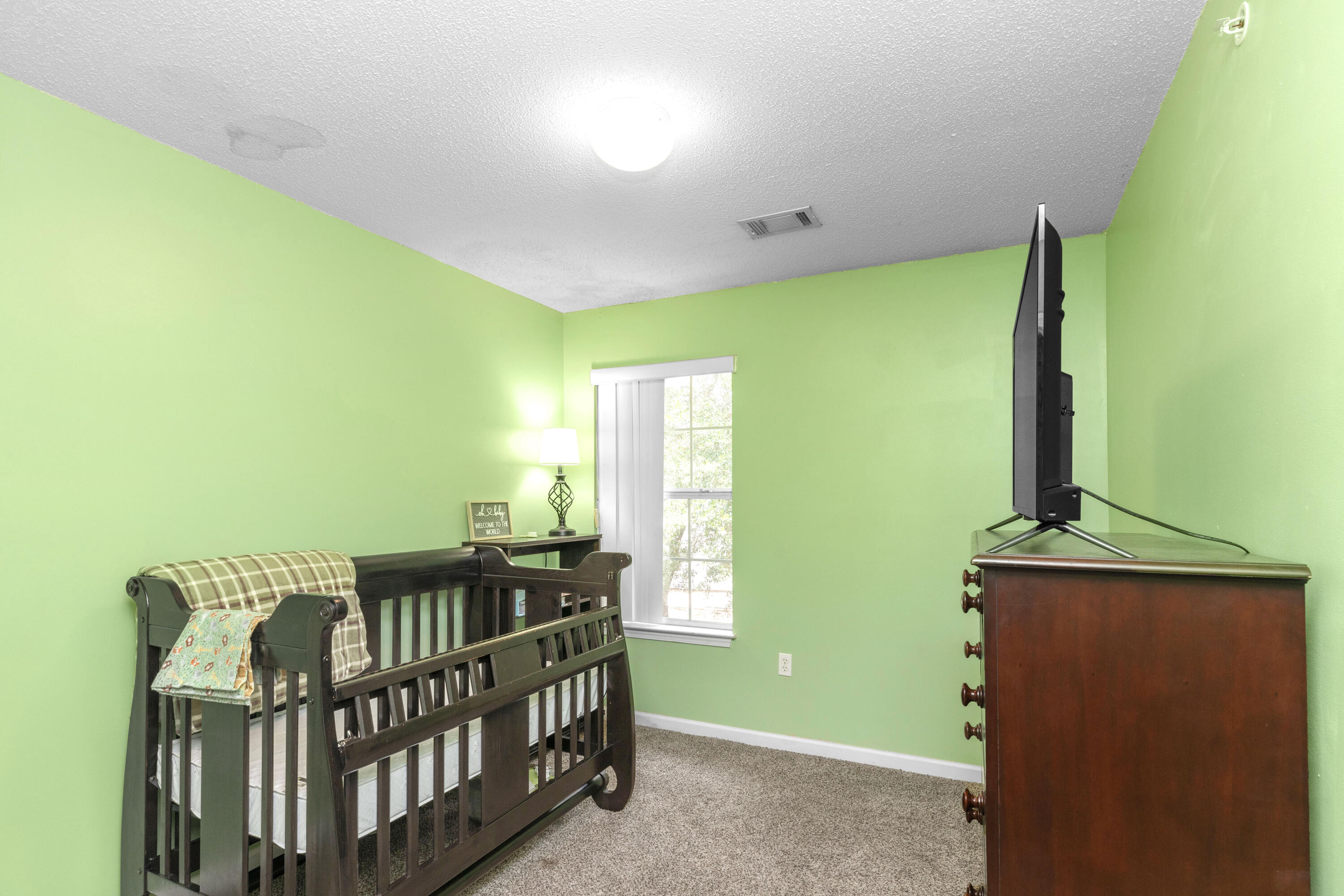 341 Crooked Pine Trail Crestview, FL 32539 - Photo 20 of 27 a bedroom with a bed and a window