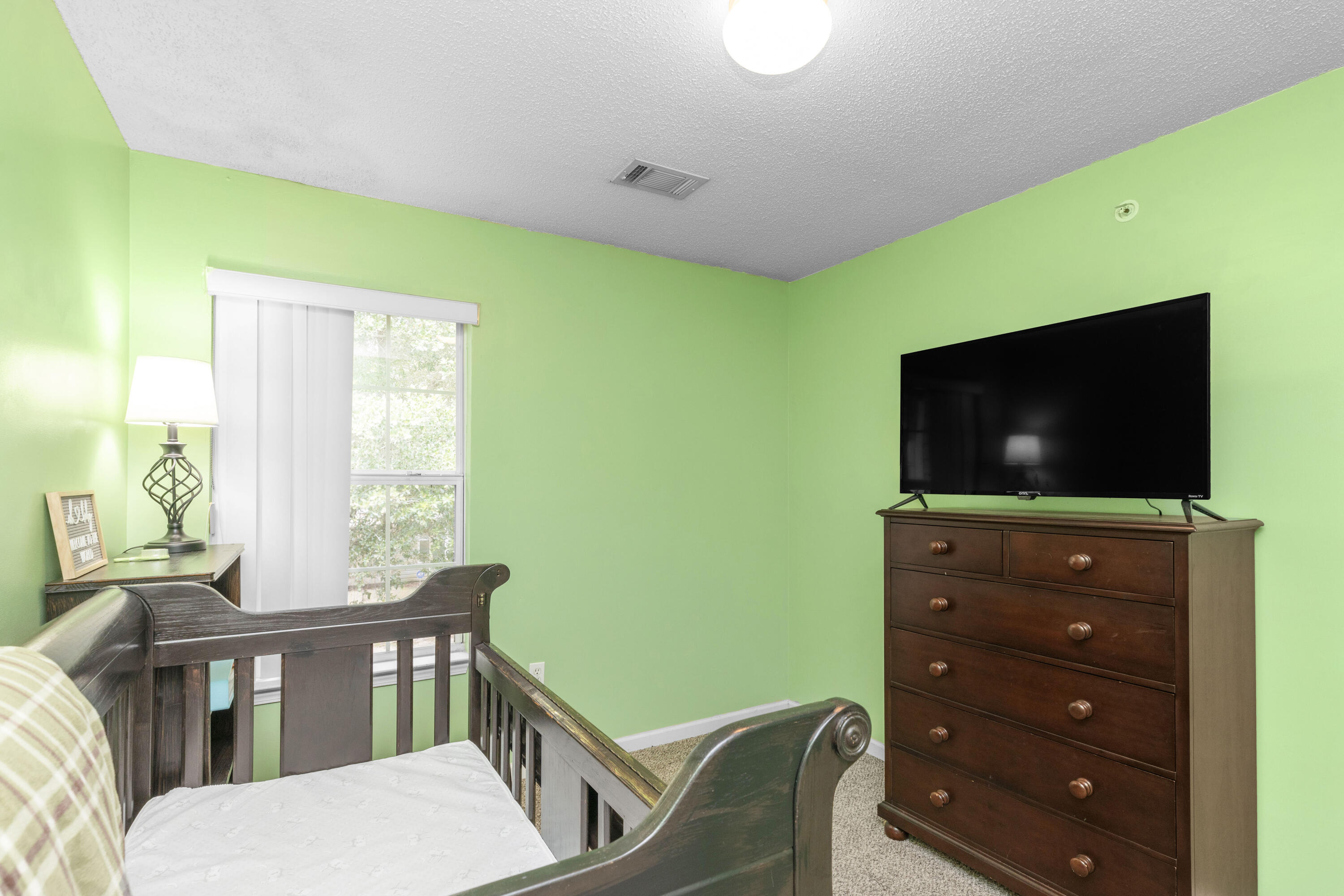 341 Crooked Pine Trail Crestview, FL 32539 - Photo 21 of 27 a living room with furniture and a flat screen tv