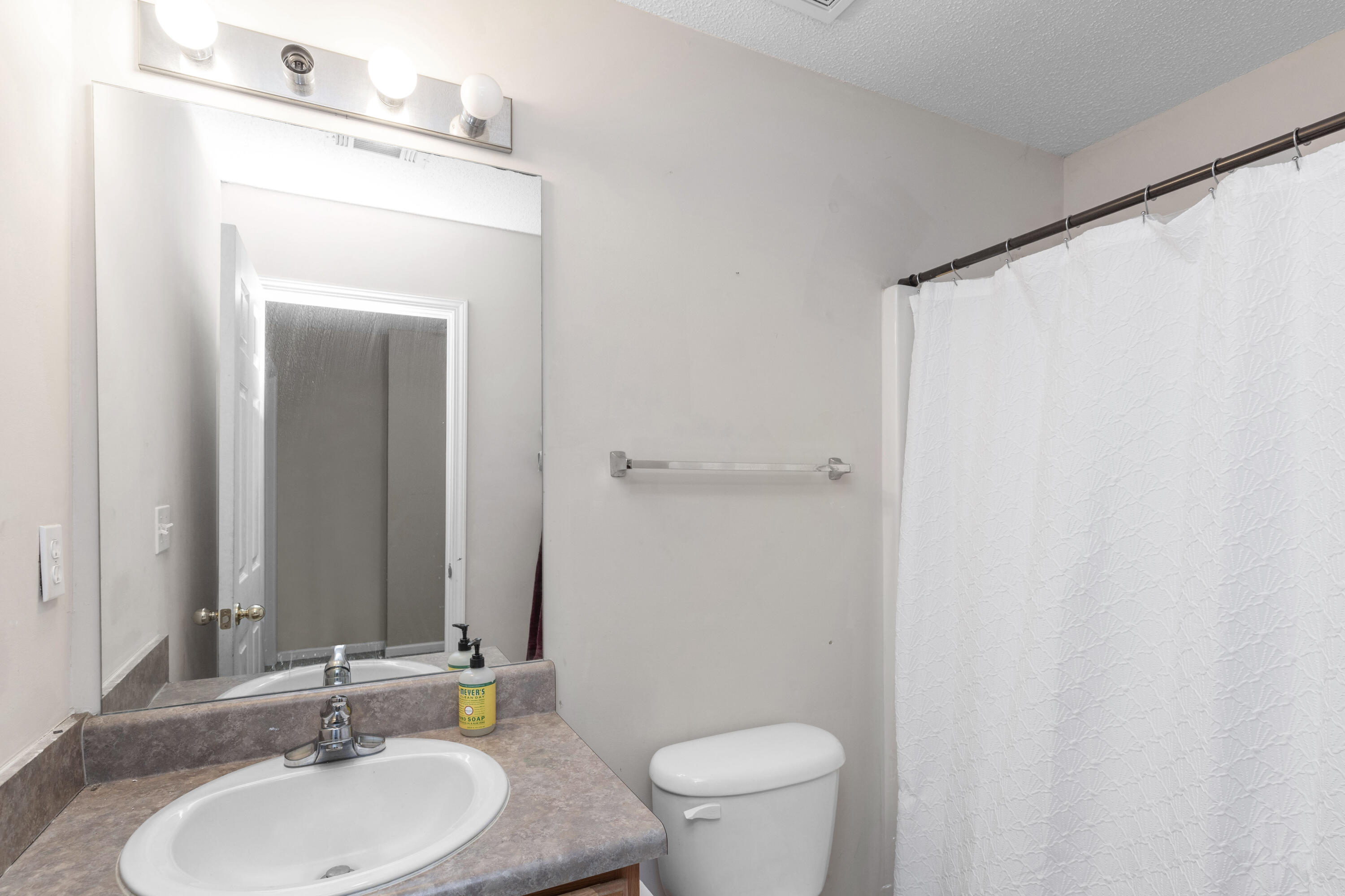 341 Crooked Pine Trail Crestview, FL 32539 - Photo 23 of 27 a bathroom with a sink and a mirror