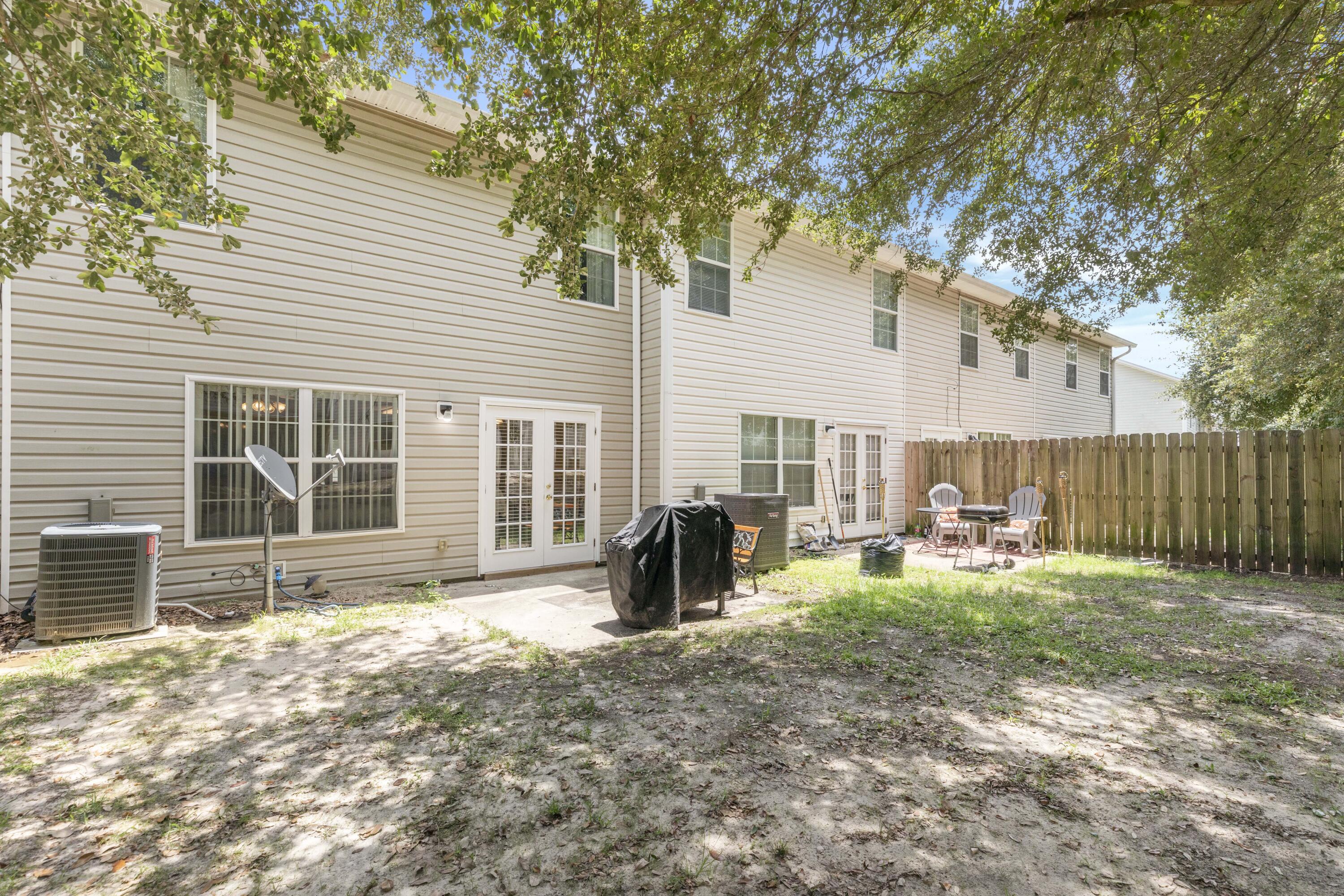 341 Crooked Pine Trail Crestview, FL 32539 - Photo 25 of 27 a view of a house with backyard and sitting area