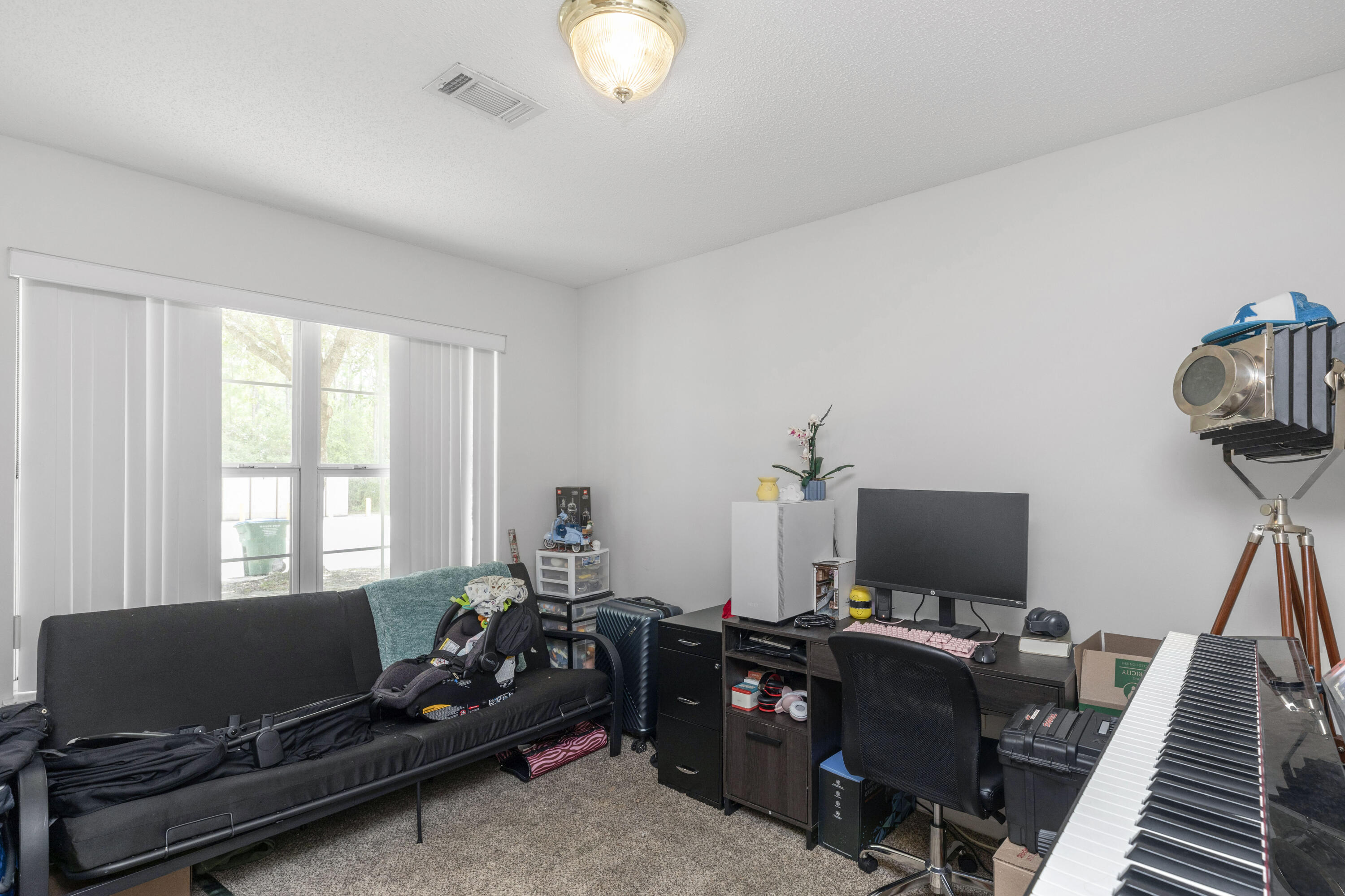 341 Crooked Pine Trail Crestview, FL 32539 - Photo 3 of 27 a living room with furniture and a flat screen tv