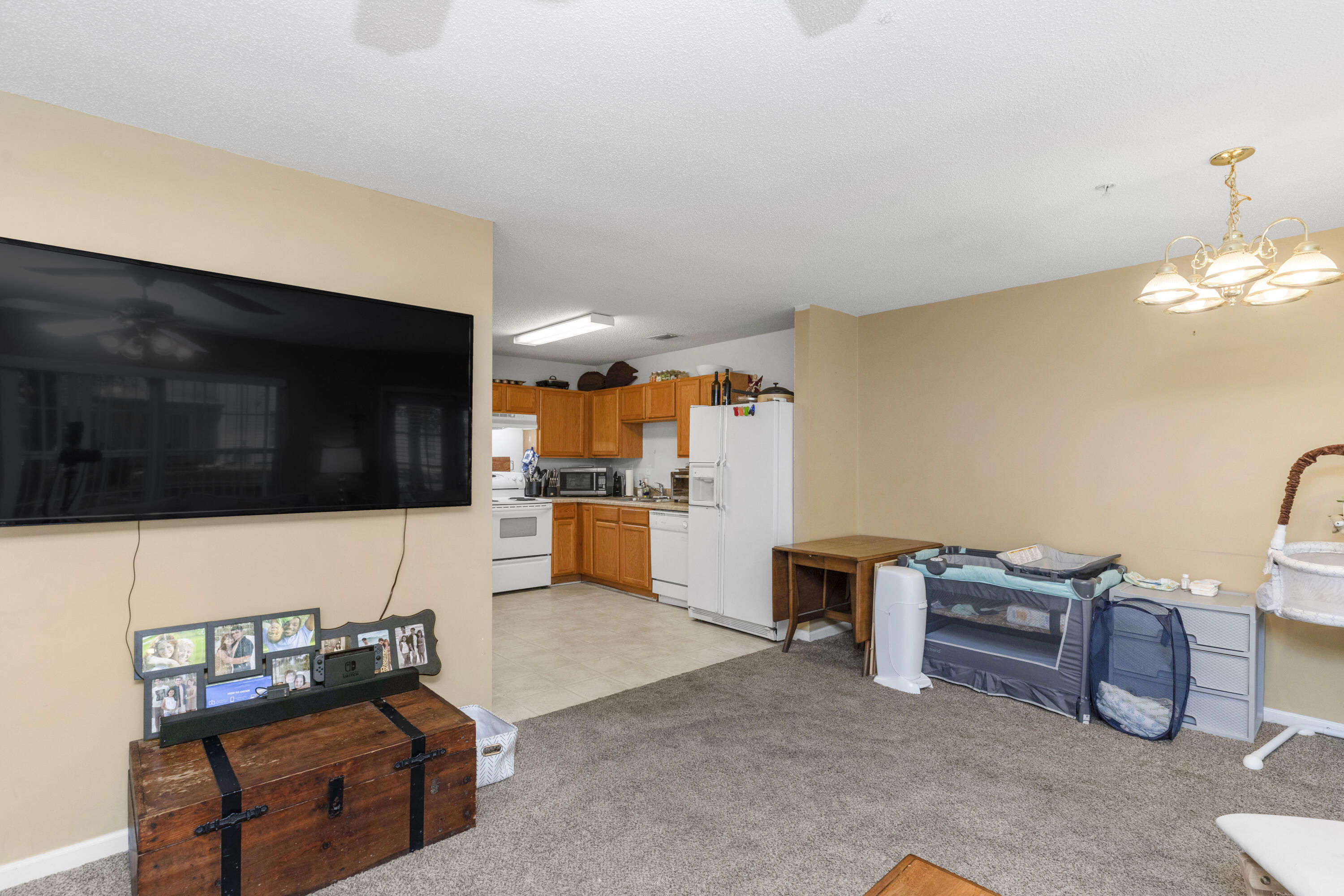 341 Crooked Pine Trail Crestview, FL 32539 - Photo 8 of 27 a living room with furniture and a flat screen tv