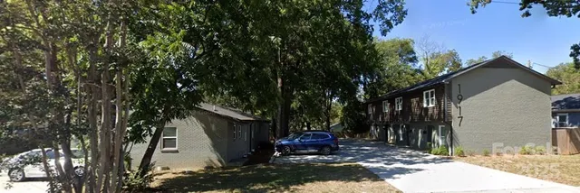 a view of a back yard of the house