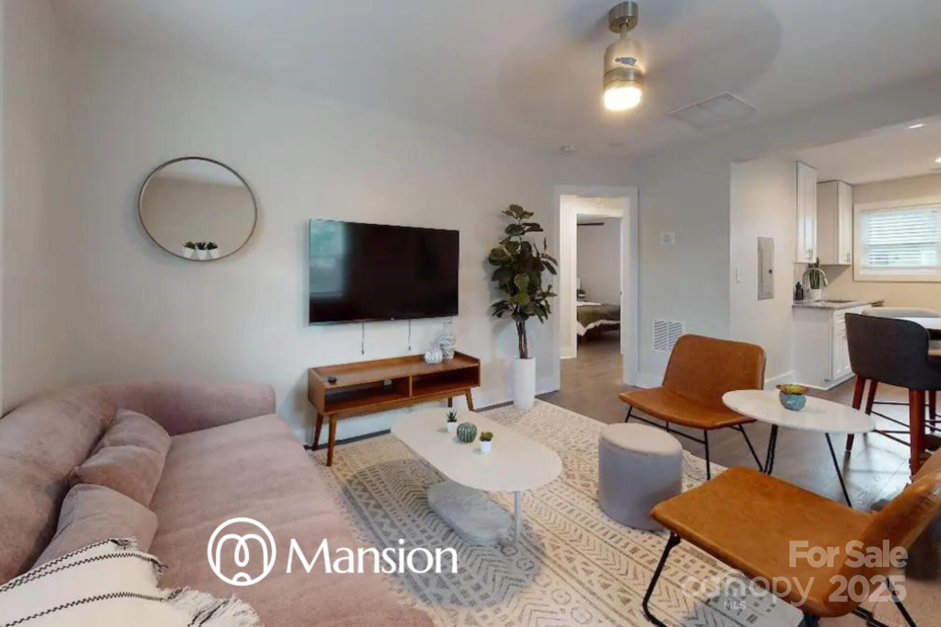 1909 Pegram Street Charlotte, NC 28205 - Photo 15 of 48 a living room with furniture and a flat screen tv
