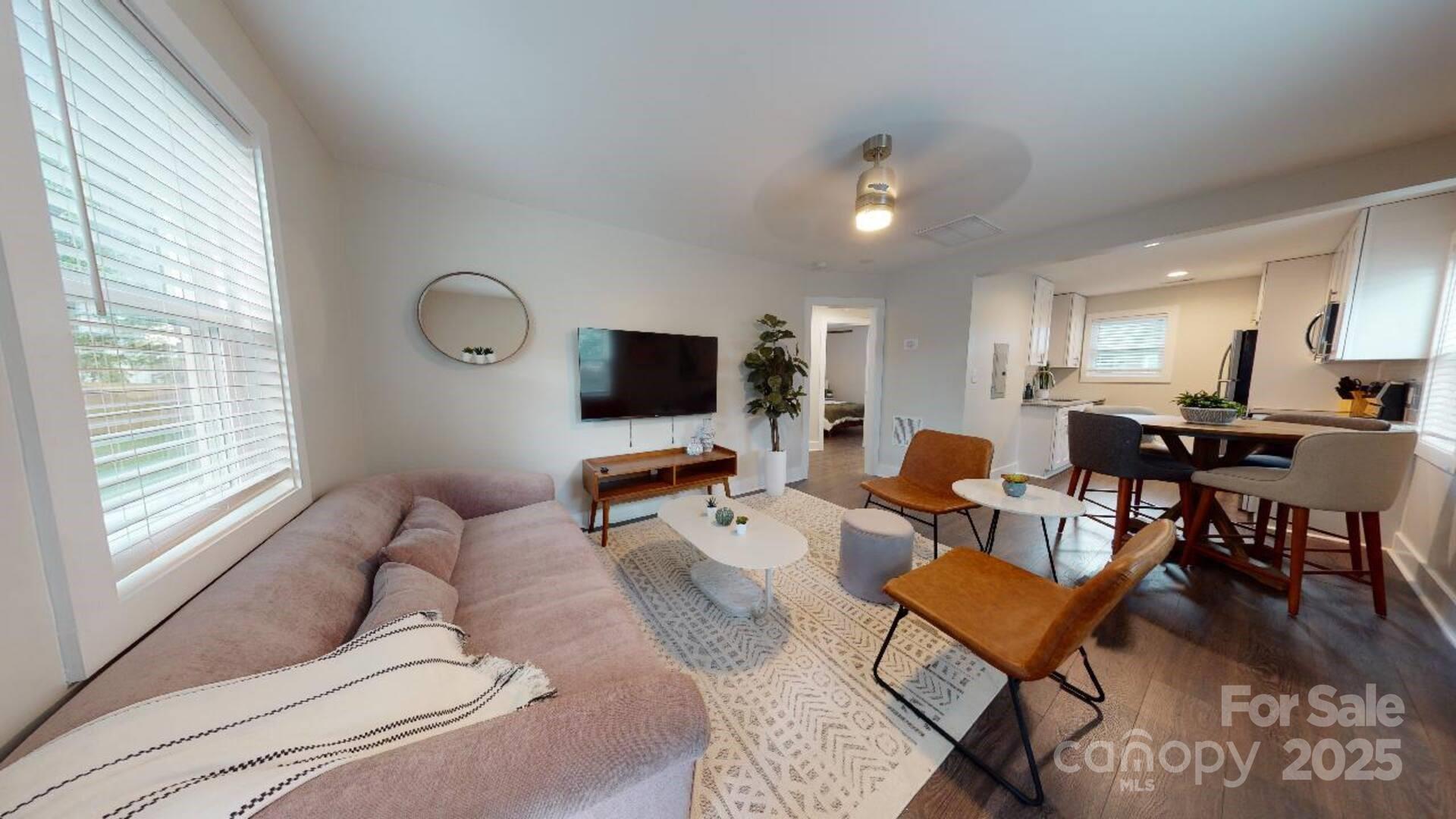 1909 Pegram Street Charlotte, NC 28205 - Photo 16 of 48 a living room with furniture and a flat screen tv