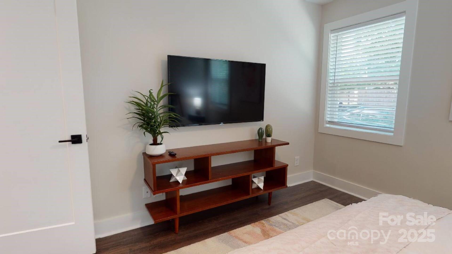 1909 Pegram Street Charlotte, NC 28205 - Photo 17 of 48 a living room with furniture and a flat screen tv