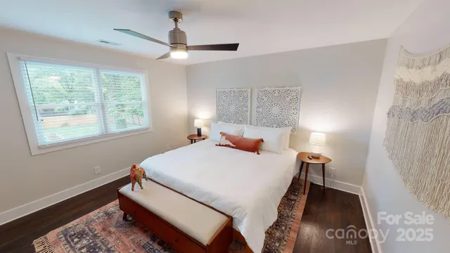 a bed room with a bed and a window