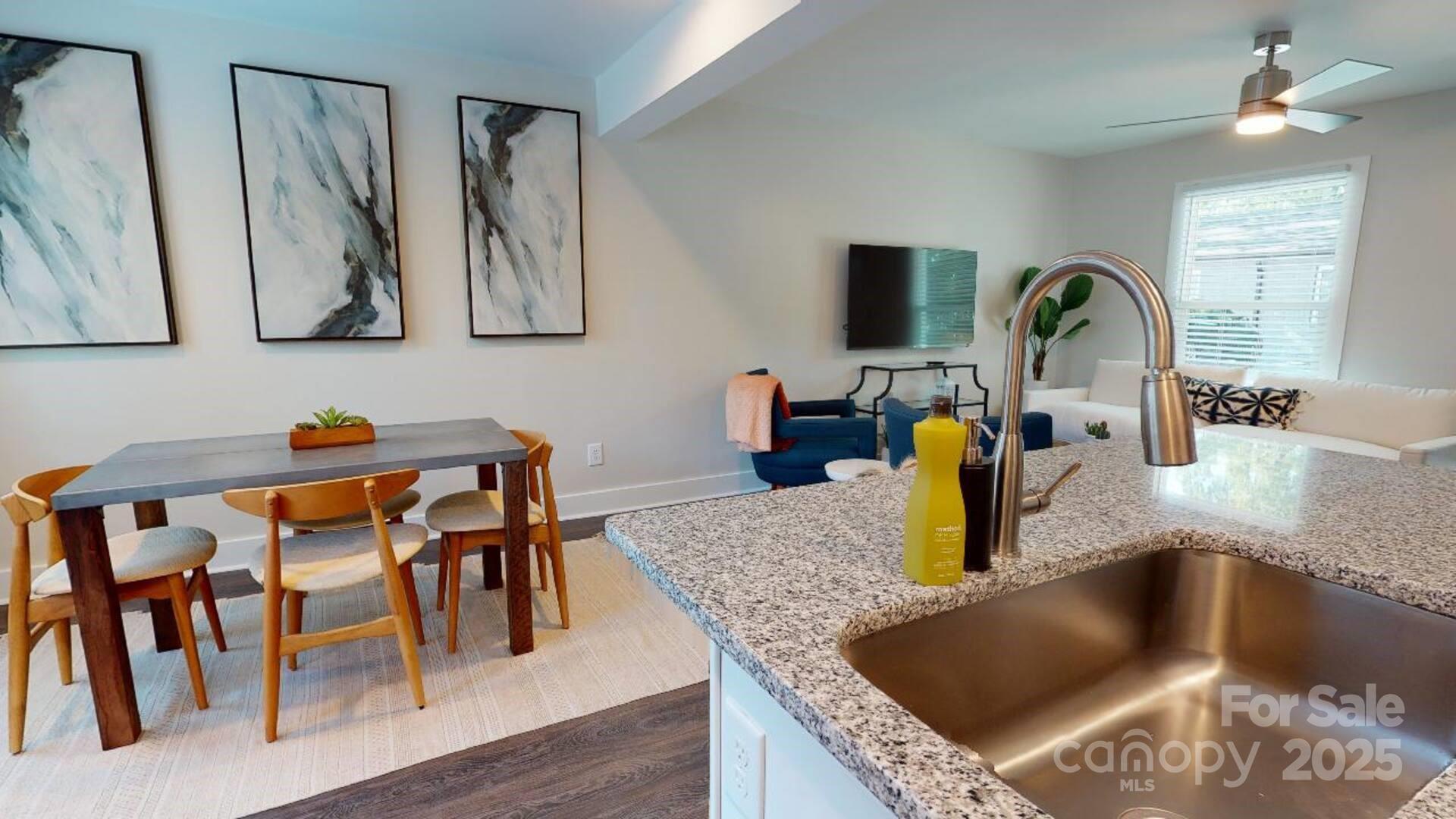 1909 Pegram Street Charlotte, NC 28205 - Photo 33 of 48 a kitchen with granite countertop a sink and a dining table