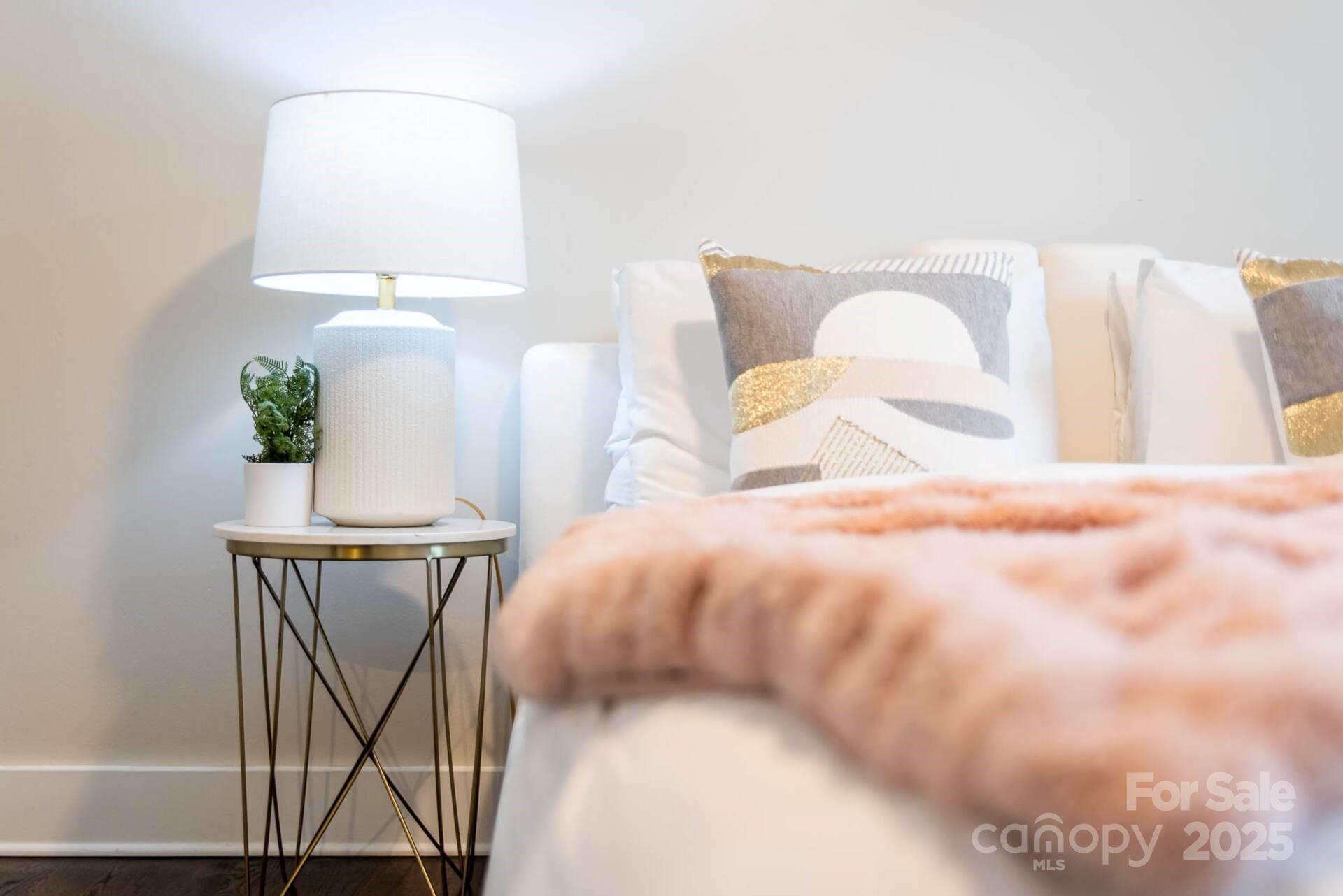 1909 Pegram Street Charlotte, NC 28205 - Photo 40 of 48 a bedroom with a bed and a chandelier