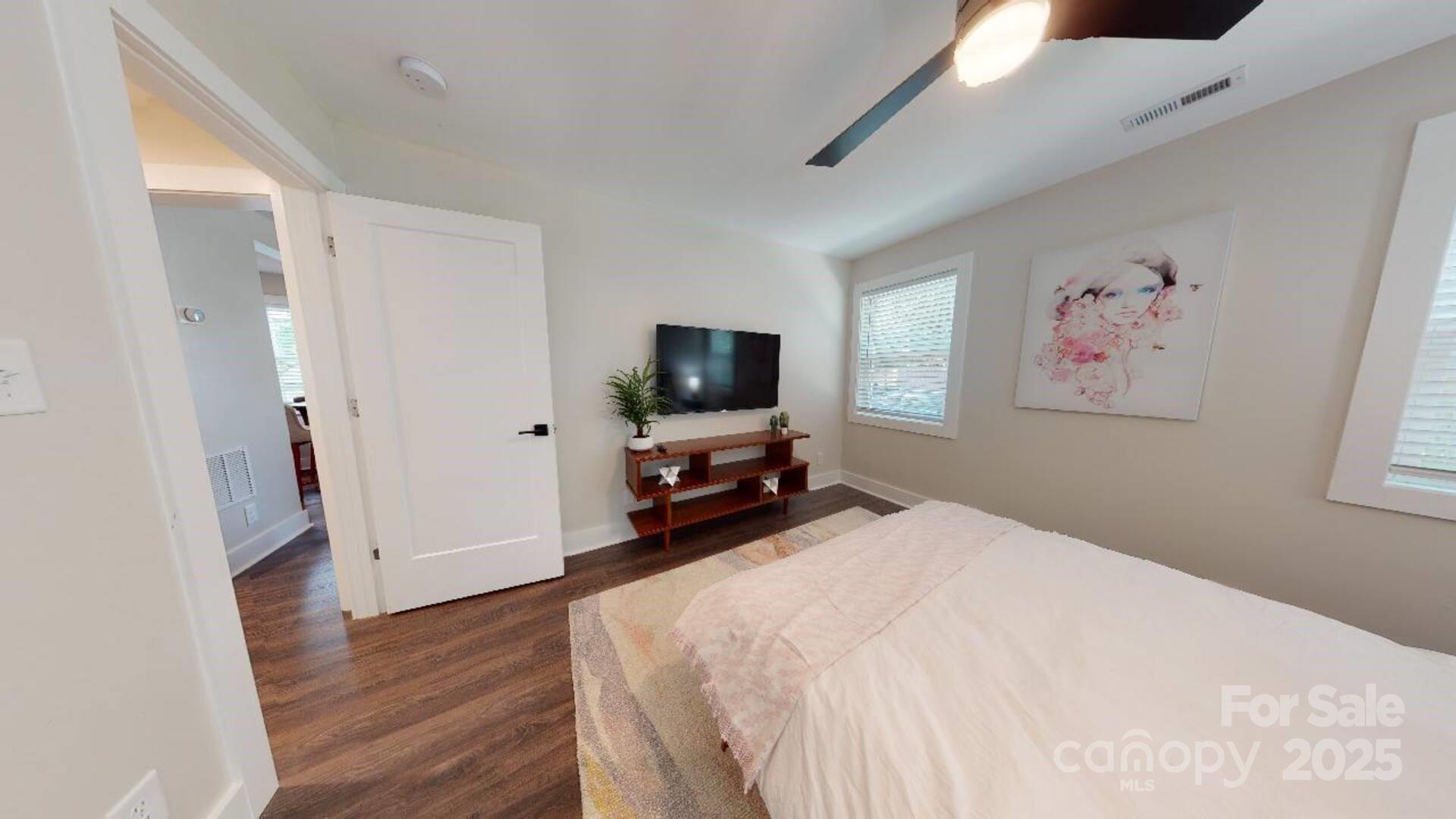 1909 Pegram Street Charlotte, NC 28205 - Photo 8 of 48 a bedroom with a bed and a flat screen tv