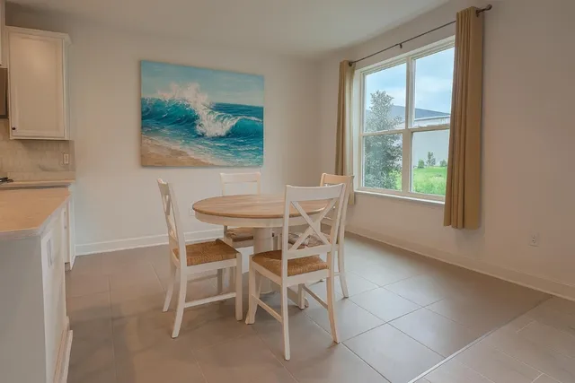 a bathroom with a sink a toilet a mirror and shower