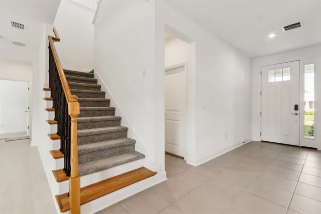 a en suite bathroom with a granite countertop sink and a mirror