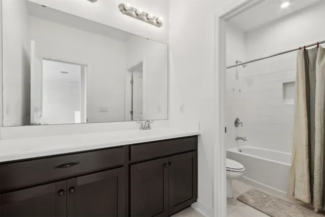 a view of a patio with a dining table and chairs