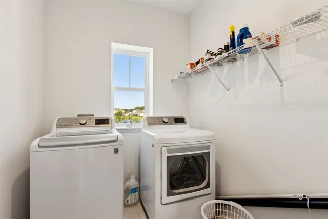 a view of a porch with furniture and a yard