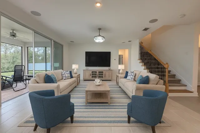 a living room with furniture and a flat screen tv