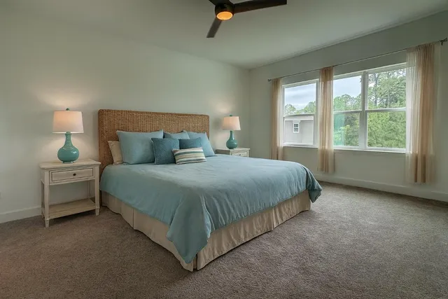 a bedroom with a bed and window