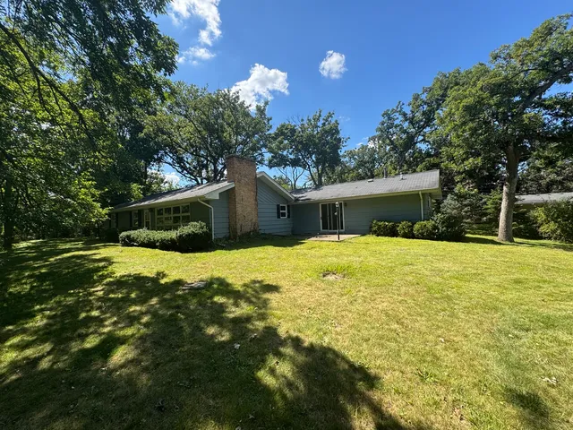 a house view with a backyard space