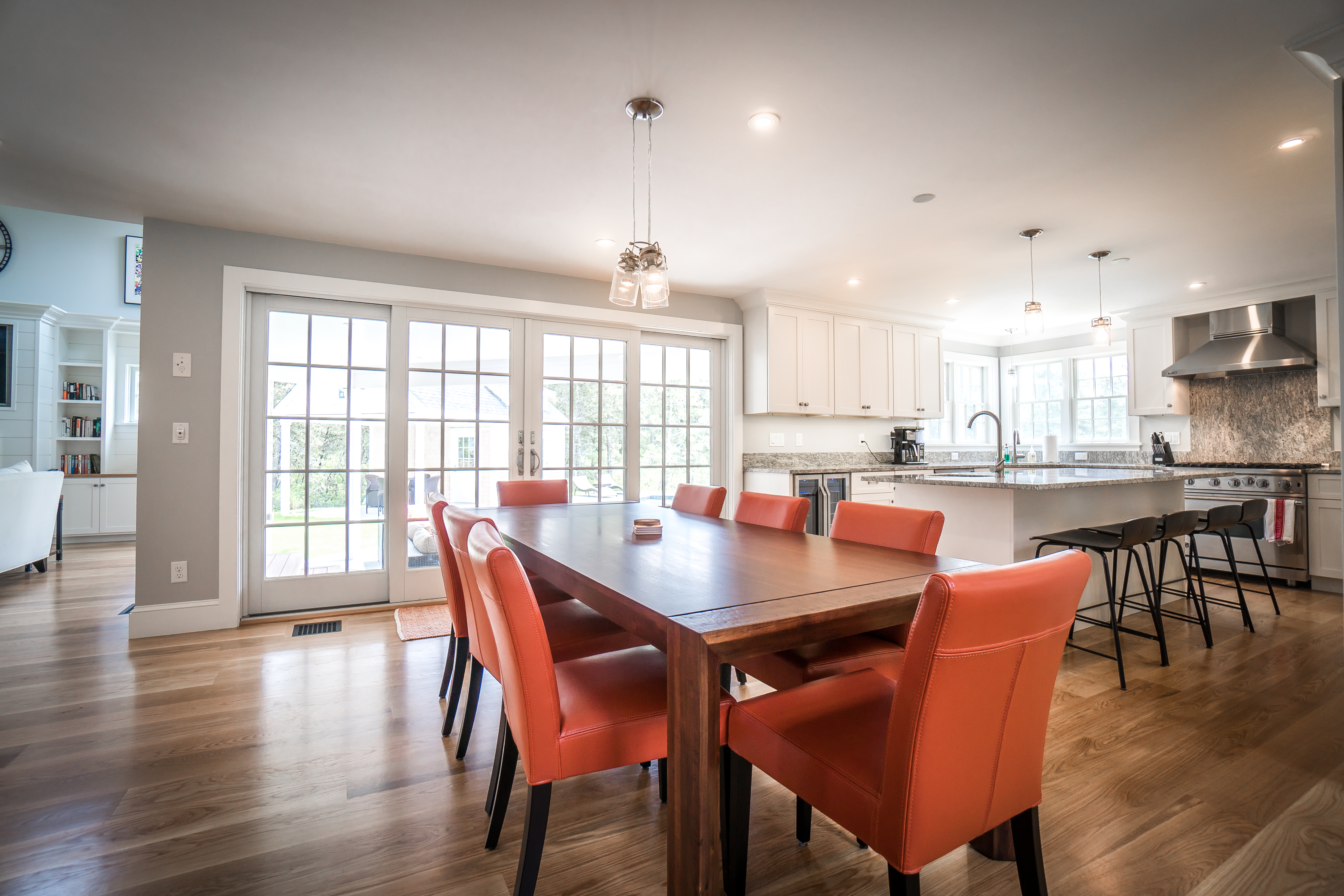 50 Lovers Lane Nantucket, MA 02554 - Photo 12 of 34 a dining room with stainless steel appliances a dining table chairs and wooden floor