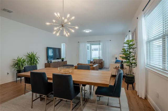 a bedroom with a bed and a table in it