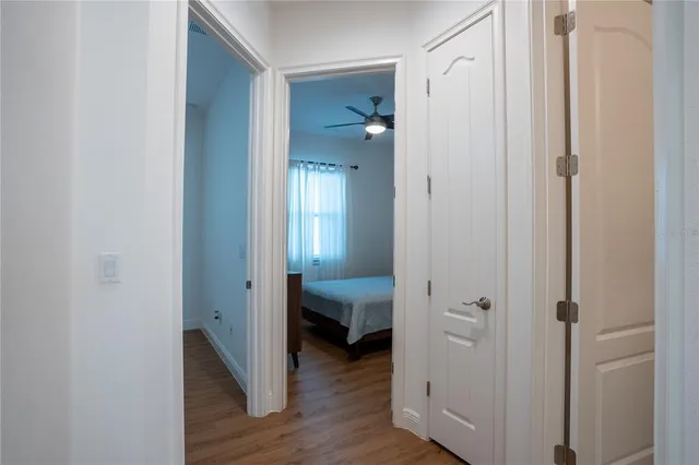 a bedroom with a bed and a night stand