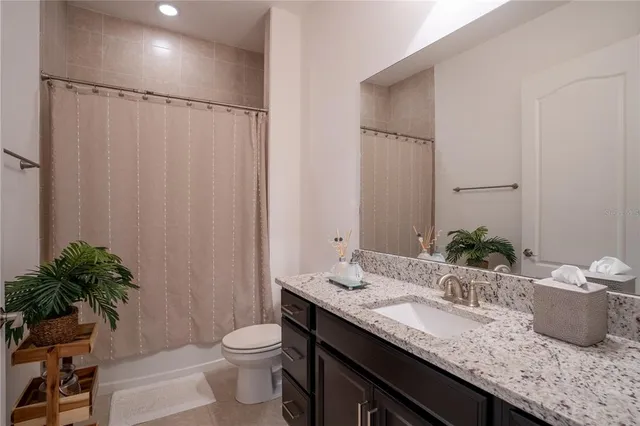 a bed room with a bed and a night stand