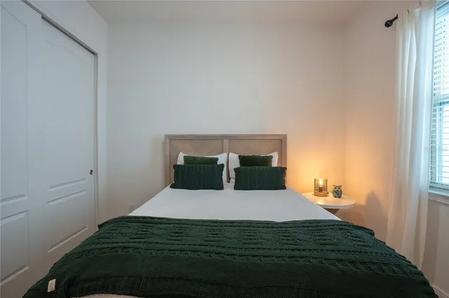 a view of walk in closet with clothes