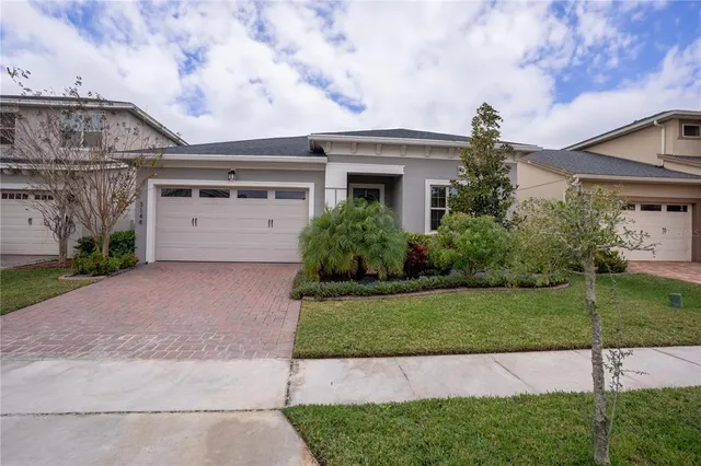 a kitchen with a stove and wooden floor