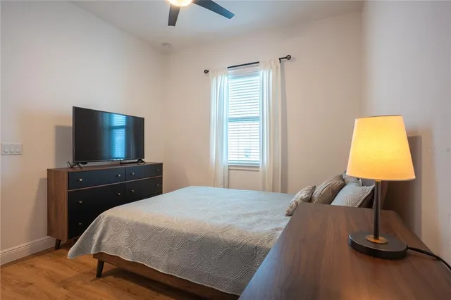 a bathroom with a double vanity sink a mirror and a shower