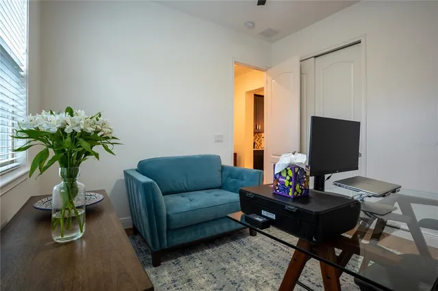 a living room with furniture and a large window