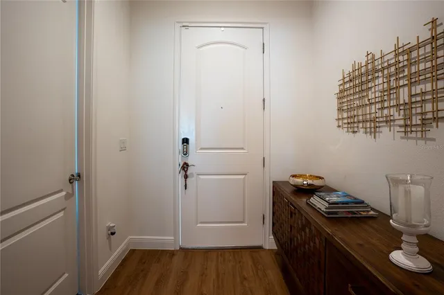 a kitchen with a sink cabinets and wooden floor