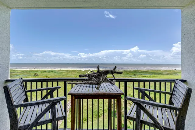 a view of a two chairs on the roof deck