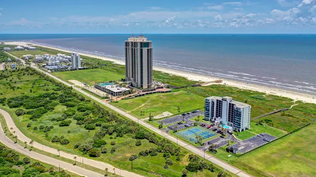 a view of a swimming pool with an ocean view