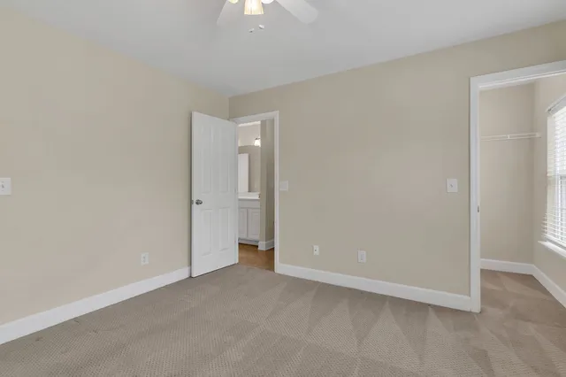 a bathroom with double vanity sink a vanity and mirror