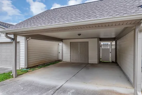 a view of a house with backyard porch and sitting area