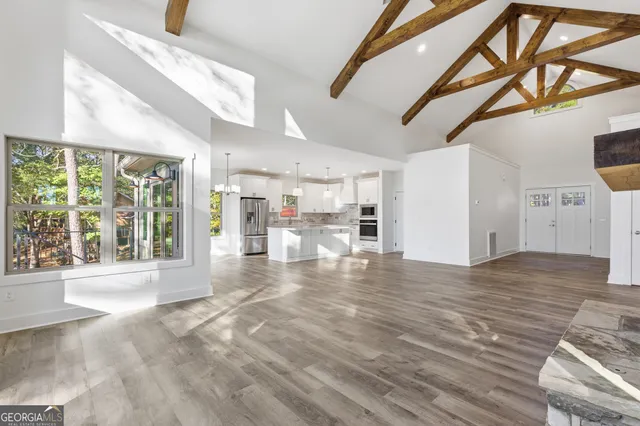 a kitchen with stainless steel appliances white cabinets and a sink