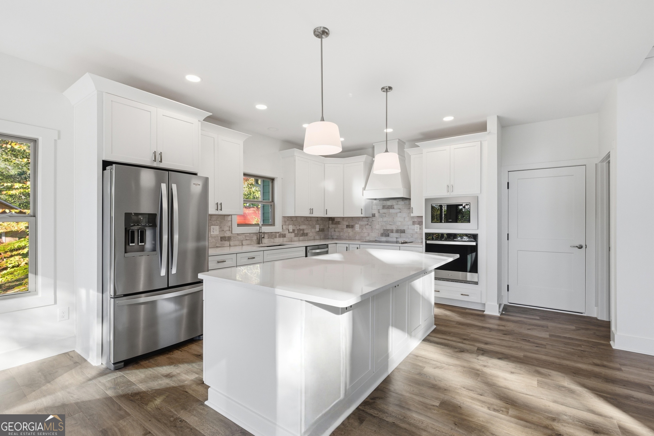 259 West Currahee Street Toccoa, GA 30577 - Photo 12 of 47 a kitchen with stainless steel appliances granite countertop a refrigerator a oven and a sink